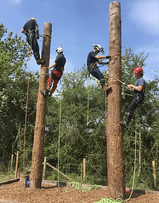 A picture of people training on the spike poles at Roland Heming's training ground